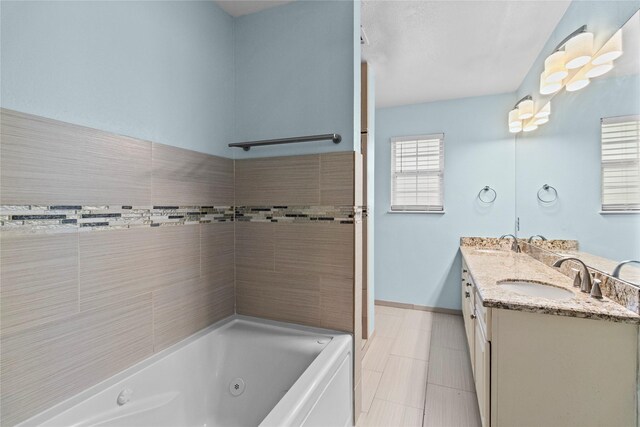 5610 Oakhaven Ln, Houston, TX 77091 - bathroom with a whirlpool tub, double vanity, baseboards, tile patterned flooring, and a shower
