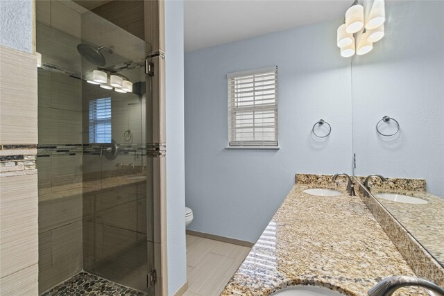 5610 Oakhaven Ln, Houston, TX 77091 - bathroom featuring toilet, double vanity, and a stall shower