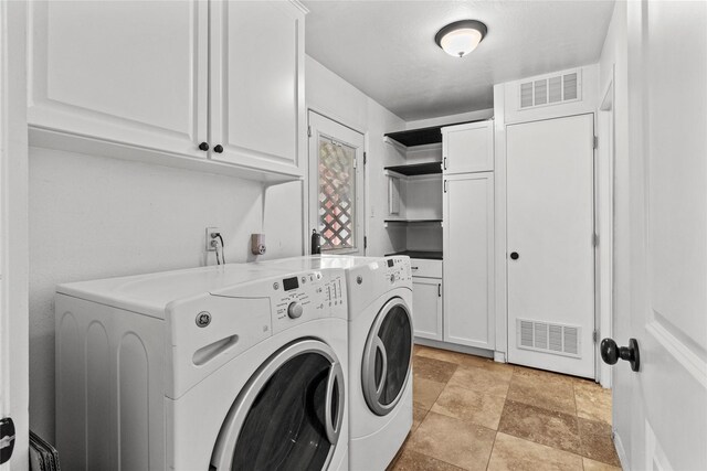 5610 Oakhaven Ln, Houston, TX 77091 - washroom with washer and clothes dryer and cabinet space