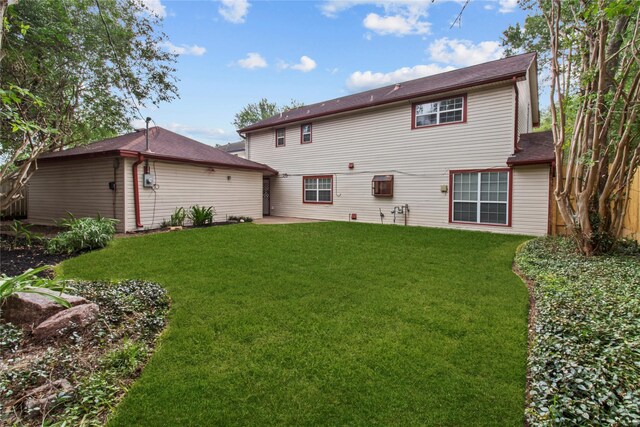 5610 Oakhaven Ln, Houston, TX 77091 - rear view of house with a yard and a patio area