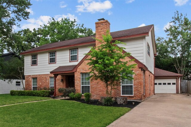 5610 Oakhaven Ln, Houston, TX 77091 - view of front of house featuring a chimney, brick siding, and a garage