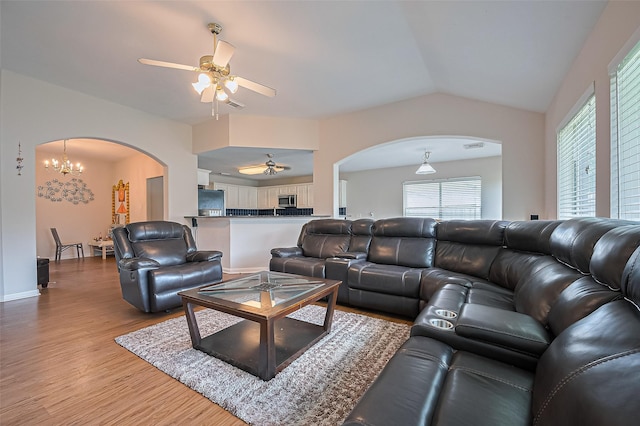 3619 Strartford Arms Ln, Sugar Land, TX 77498 - living area with arched walkways, ceiling fan, light wood-style flooring, plenty of natural light, and vaulted ceiling