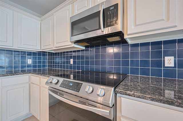 3619 Strartford Arms Ln, Sugar Land, TX 77498 - kitchen featuring stainless steel appliances, white cabinets, dark stone countertops, and backsplash
