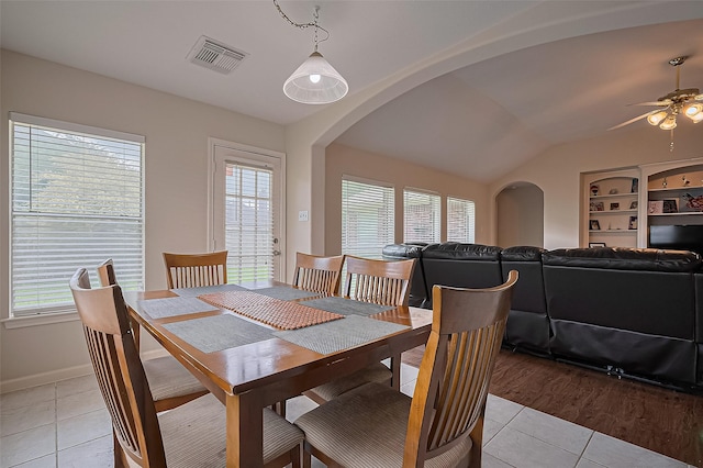 3619 Strartford Arms Ln, Sugar Land, TX 77498 - dining area featuring light tile patterned flooring, arched walkways, a ceiling fan, and lofted ceiling