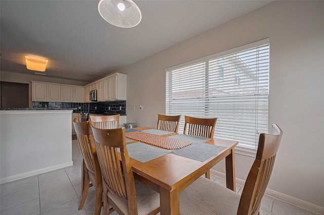 3619 Strartford Arms Ln, Sugar Land, TX 77498 - dining space featuring light tile patterned floors and baseboards
