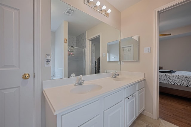 3619 Strartford Arms Ln, Sugar Land, TX 77498 - ensuite bathroom featuring double vanity, a shower, and tile patterned flooring