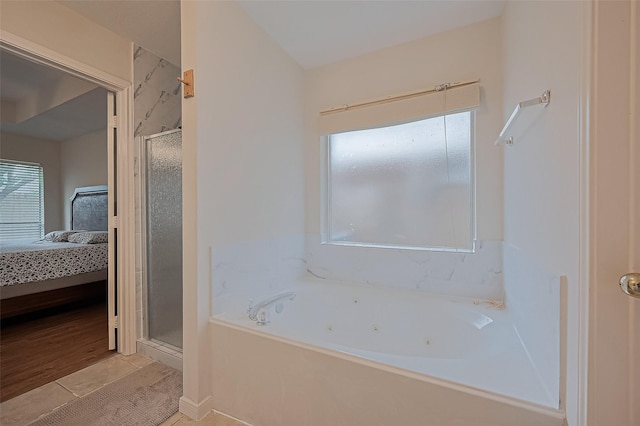 3619 Strartford Arms Ln, Sugar Land, TX 77498 - ensuite bathroom featuring a shower stall, a jetted tub, and tile patterned flooring