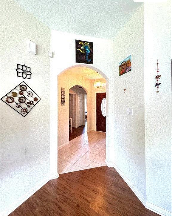 3619 Strartford Arms Ln, Sugar Land, TX 77498 - hall featuring arched walkways and wood finished floors