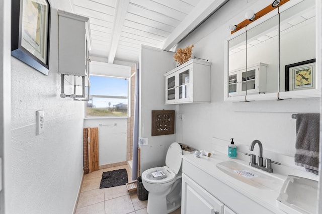523 Blue Water Hwy, Surfside Beach, TX 77541 - full bath featuring a shower, tile patterned floors, toilet, vanity, and wooden ceiling with exposed beams