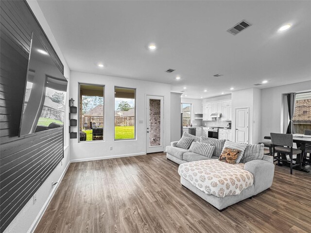 4326 Camden Springs Trl, Porter, TX 77365 - living area featuring dark wood finished floors, recessed lighting, and baseboards