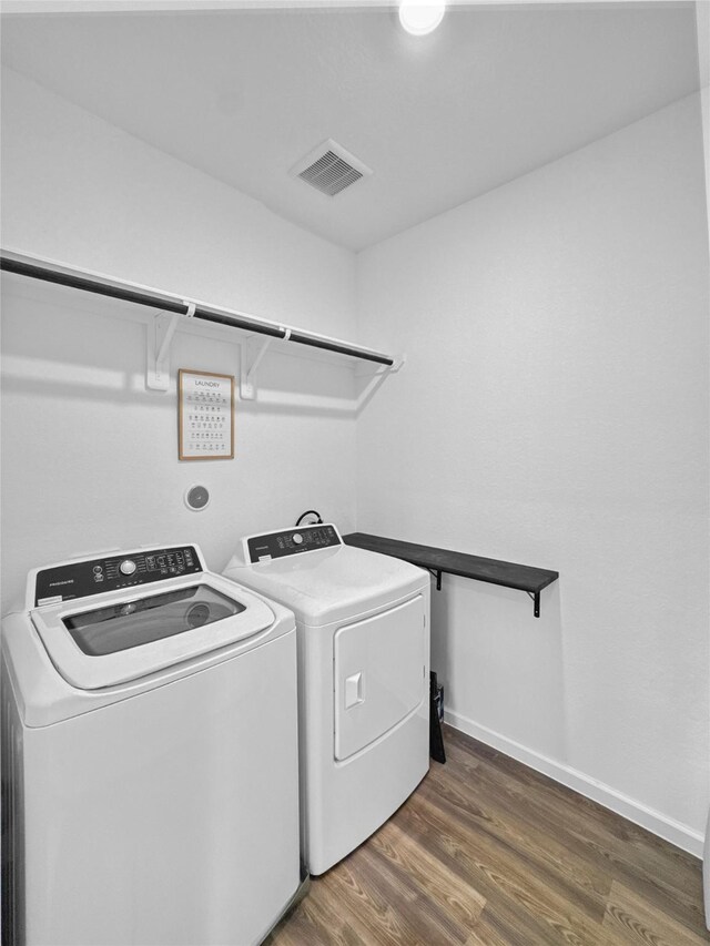 4326 Camden Springs Trl, Porter, TX 77365 - washroom featuring separate washer and dryer, wood finished floors, and baseboards