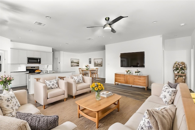 17718 Sommerset Falls Ln, Crosby, TX 77532 - living room featuring ceiling fan, wood finished floors, and recessed lighting