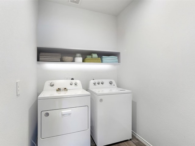17718 Sommerset Falls Ln, Crosby, TX 77532 - washroom featuring washing machine and clothes dryer, wood finished floors, and baseboards