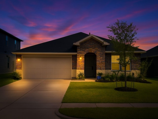 17718 Sommerset Falls Ln, Crosby, TX 77532 - view of front facade featuring driveway, a garage, brick siding, and a lawn
