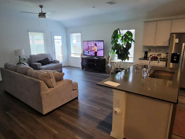 17718 Sommerset Falls Ln, Crosby, TX 77532 - living area with ceiling fan, dark wood finished floors, and lofted ceiling