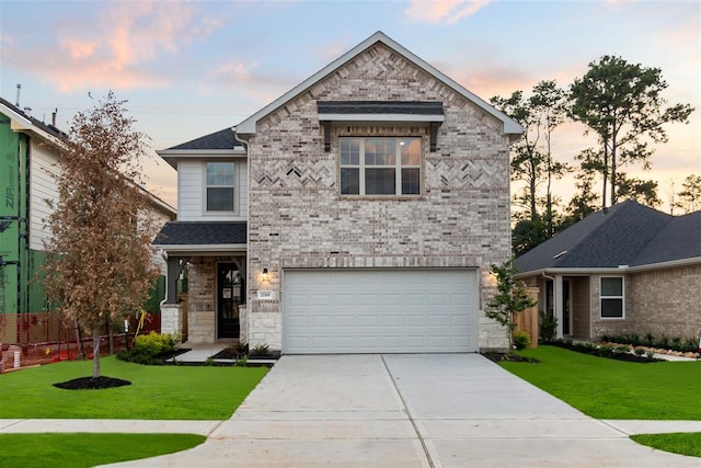 4826 Sand Clouds, Katy, TX 77493 - view of front of house featuring a yard, driveway, an attached garage, and brick siding
