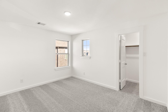 4826 Sand Clouds, Katy, TX 77493 - unfurnished bedroom with carpet floors, a walk in closet, baseboards, and a closet