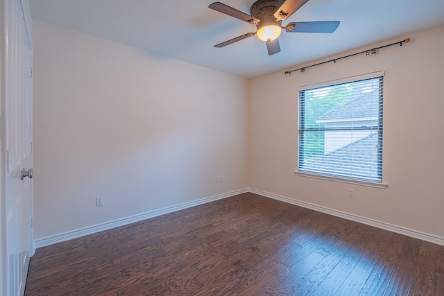 23 N Plum Crest Cir, The Woodlands, TX 77382 - unfurnished room with dark wood-style flooring, baseboards, and ceiling fan