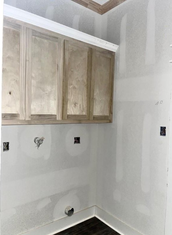 10730 Vinson St, Beaumont, TX 77713 - laundry area featuring baseboards and dark wood-style flooring