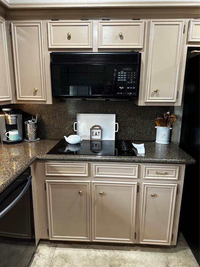 kitchen featuring black appliances, backsplash, and dark stone countertops