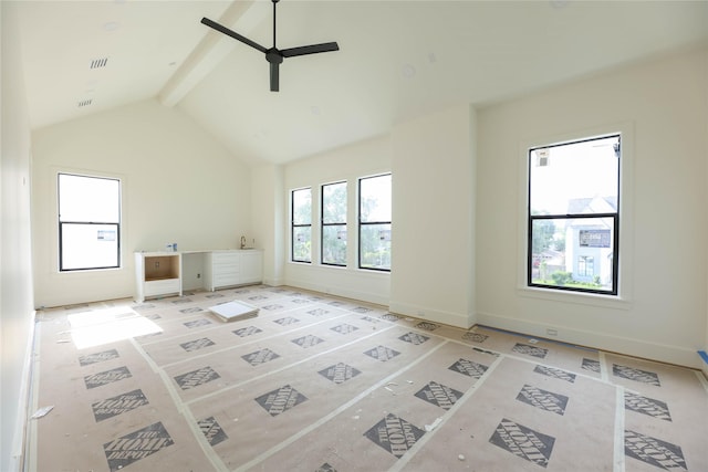 1032 W 41st St, Houston, TX 77018 - unfurnished living room featuring plenty of natural light, a ceiling fan, and baseboards