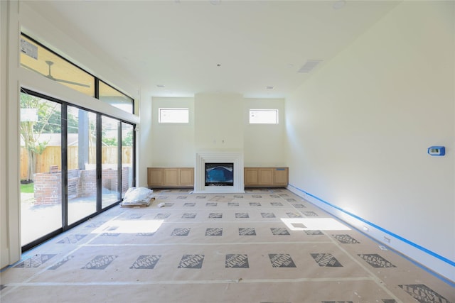 1032 W 41st St, Houston, TX 77018 - unfurnished living room with a glass covered fireplace