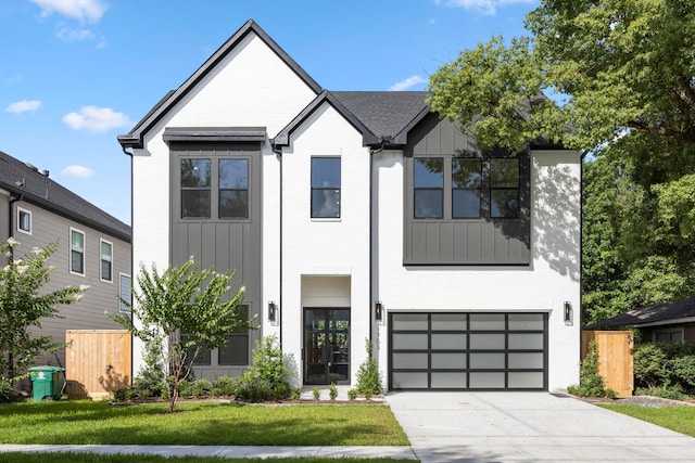 1032 W 41st St, Houston, TX 77018 - view of front of home featuring a garage, driveway, and brick siding