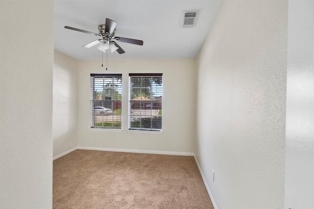 10911 Cedar Bridge St, Houston, TX 77075 - unfurnished room with carpet floors, baseboards, ceiling fan, and a textured wall