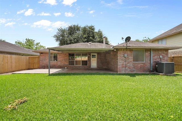 10911 Cedar Bridge St, Houston, TX 77075 - back of house with cooling unit, a patio area, brick siding, and a shingled roof