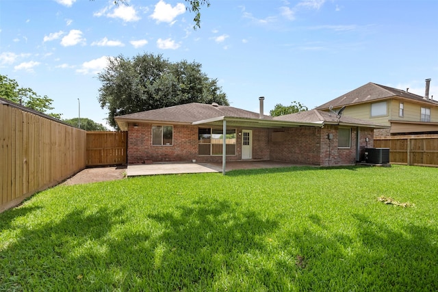 10911 Cedar Bridge St, Houston, TX 77075 - rear view of house with central AC, a patio area, and brick siding
