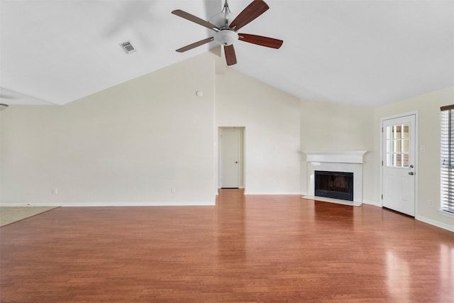 10911 Cedar Bridge St, Houston, TX 77075 - unfurnished living room with wood finished floors, a premium fireplace, a ceiling fan, baseboards, and high vaulted ceiling