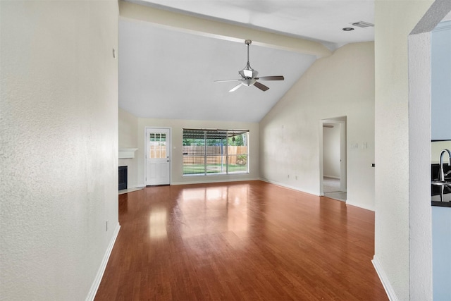 10911 Cedar Bridge St, Houston, TX 77075 - unfurnished living room with a ceiling fan, wood finished floors, high vaulted ceiling, baseboards, and a fireplace with flush hearth