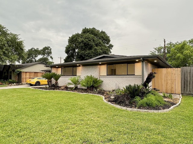 5450 Ariel St, Houston, TX 77096 - view of front of property with brick siding and concrete driveway