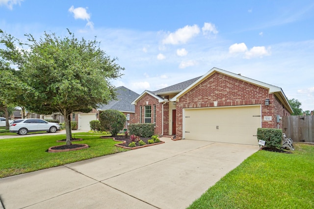 5011 Grand Chateau Ln, Houston, TX 77084 - view of front of house featuring brick siding, driveway, an attached garage, and a shingled roof