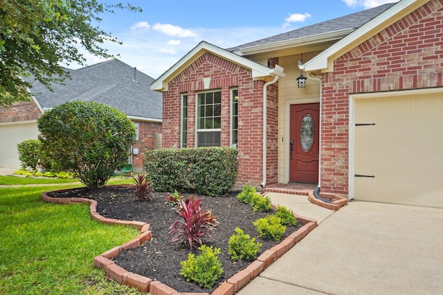 5011 Grand Chateau Ln, Houston, TX 77084 - entrance to property featuring brick siding, roof with shingles, an attached garage, and driveway