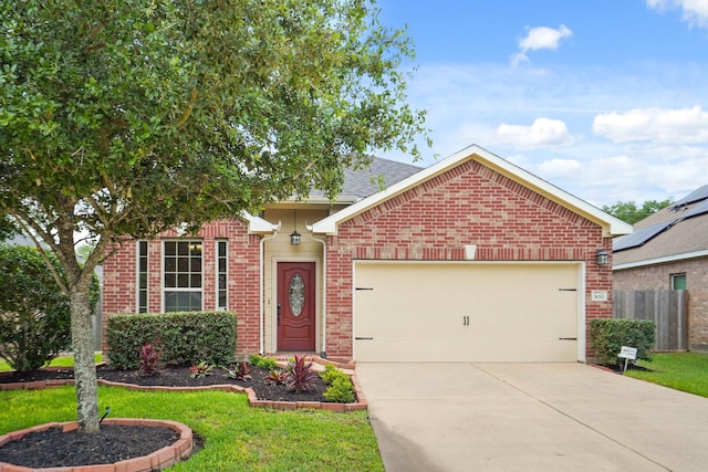5011 Grand Chateau Ln, Houston, TX 77084 - view of front of property with brick siding, an attached garage, and concrete driveway