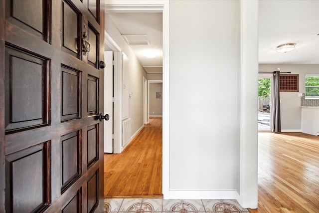 2009 Sedgie Dr, Houston, TX 77080 - corridor with attic access, light wood finished floors, and baseboards