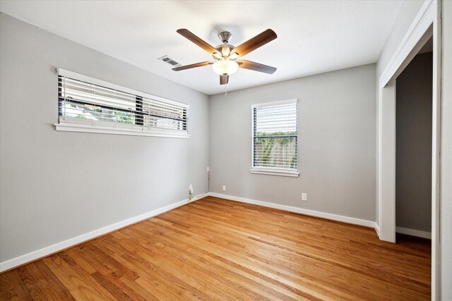 2009 Sedgie Dr, Houston, TX 77080 - unfurnished bedroom with light wood finished floors, baseboards, and ceiling fan