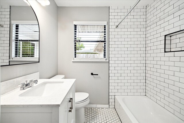 2009 Sedgie Dr, Houston, TX 77080 - bathroom featuring toilet, tile patterned flooring, vanity, and washtub / shower combination