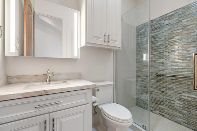 3 Maroon Creek Ct, The Woodlands, TX 77389 - full bathroom featuring vanity, toilet, and a shower stall