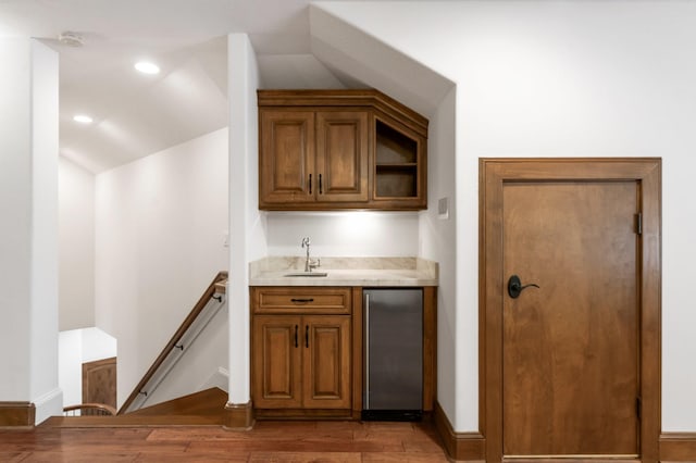 3 Maroon Creek Ct, The Woodlands, TX 77389 - indoor wet bar with refrigerator, light wood-type flooring, baseboards, recessed lighting, and vaulted ceiling