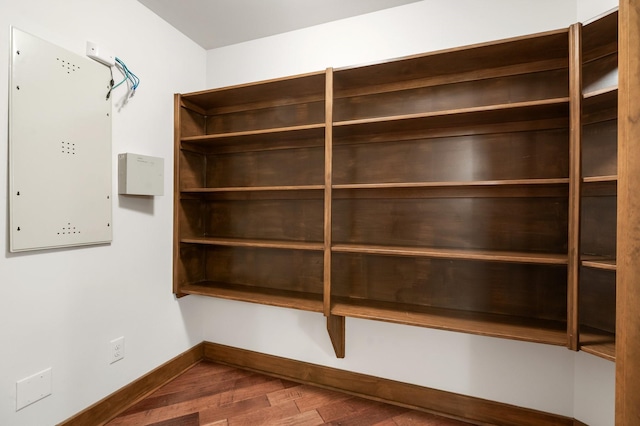 3 Maroon Creek Ct, The Woodlands, TX 77389 - spacious closet with dark wood-style floors and electric panel