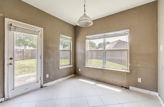 1418 High Thicket Ct, Spring, TX 77373 - unfurnished dining area with light tile patterned floors and baseboards