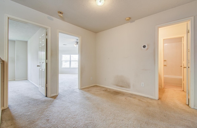1418 High Thicket Ct, Spring, TX 77373 - carpeted spare room with baseboards, a smoke detector, a textured ceiling, and ceiling fan