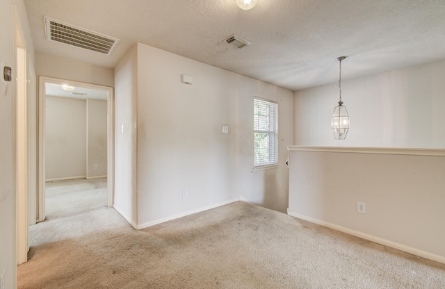 1418 High Thicket Ct, Spring, TX 77373 - empty room with carpet flooring, baseboards, and a textured ceiling