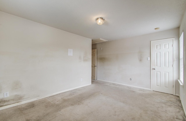 1418 High Thicket Ct, Spring, TX 77373 - empty room featuring attic access, carpet flooring, and baseboards