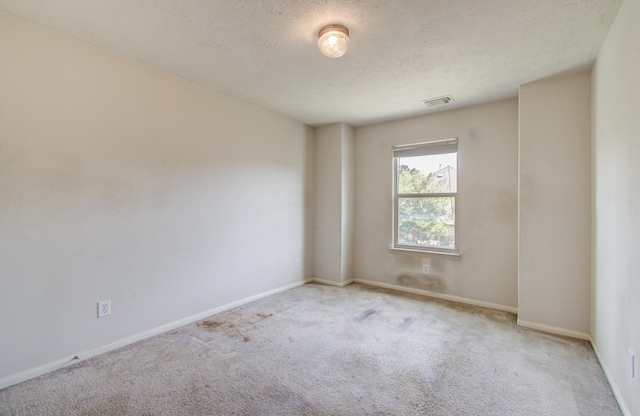 1418 High Thicket Ct, Spring, TX 77373 - empty room with carpet, a textured ceiling, and baseboards