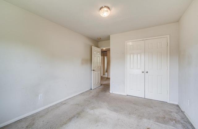 1418 High Thicket Ct, Spring, TX 77373 - unfurnished bedroom with baseboards, carpet, and a closet