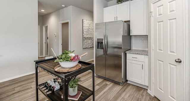 310 Bandit Cove Ct, Crosby, TX 77354 - kitchen featuring stainless steel fridge, light wood-style floors, white cabinetry, and recessed lighting