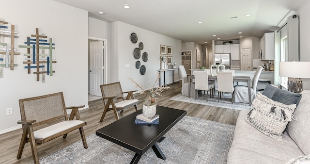 310 Bandit Cove Ct, Crosby, TX 77354 - living area with light wood-style floors, recessed lighting, and baseboards